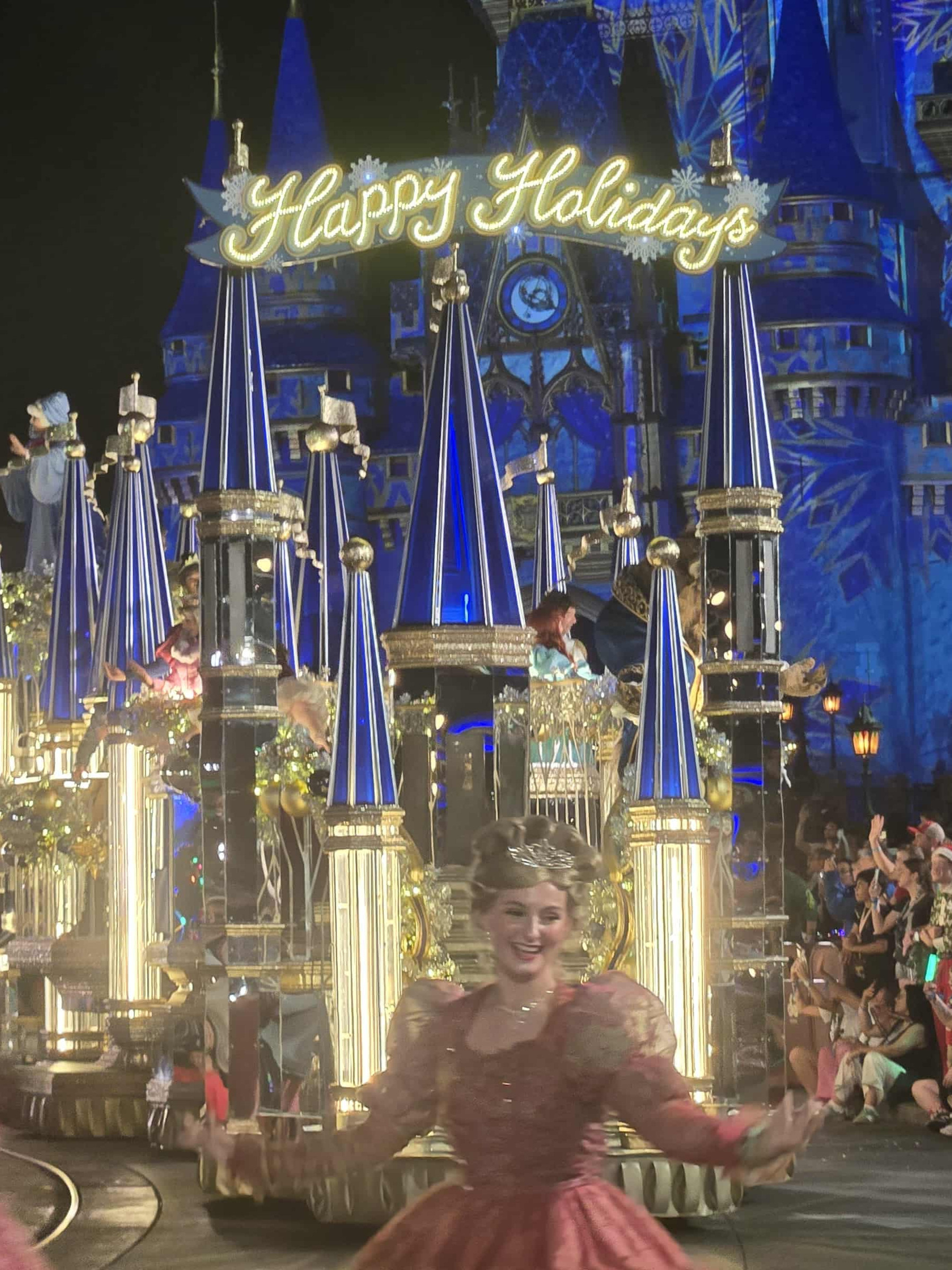 Christmas parade at Magic Kingdom in front of the illuminated castle during Mickey&rsquo;s Very Merry Christmas Party